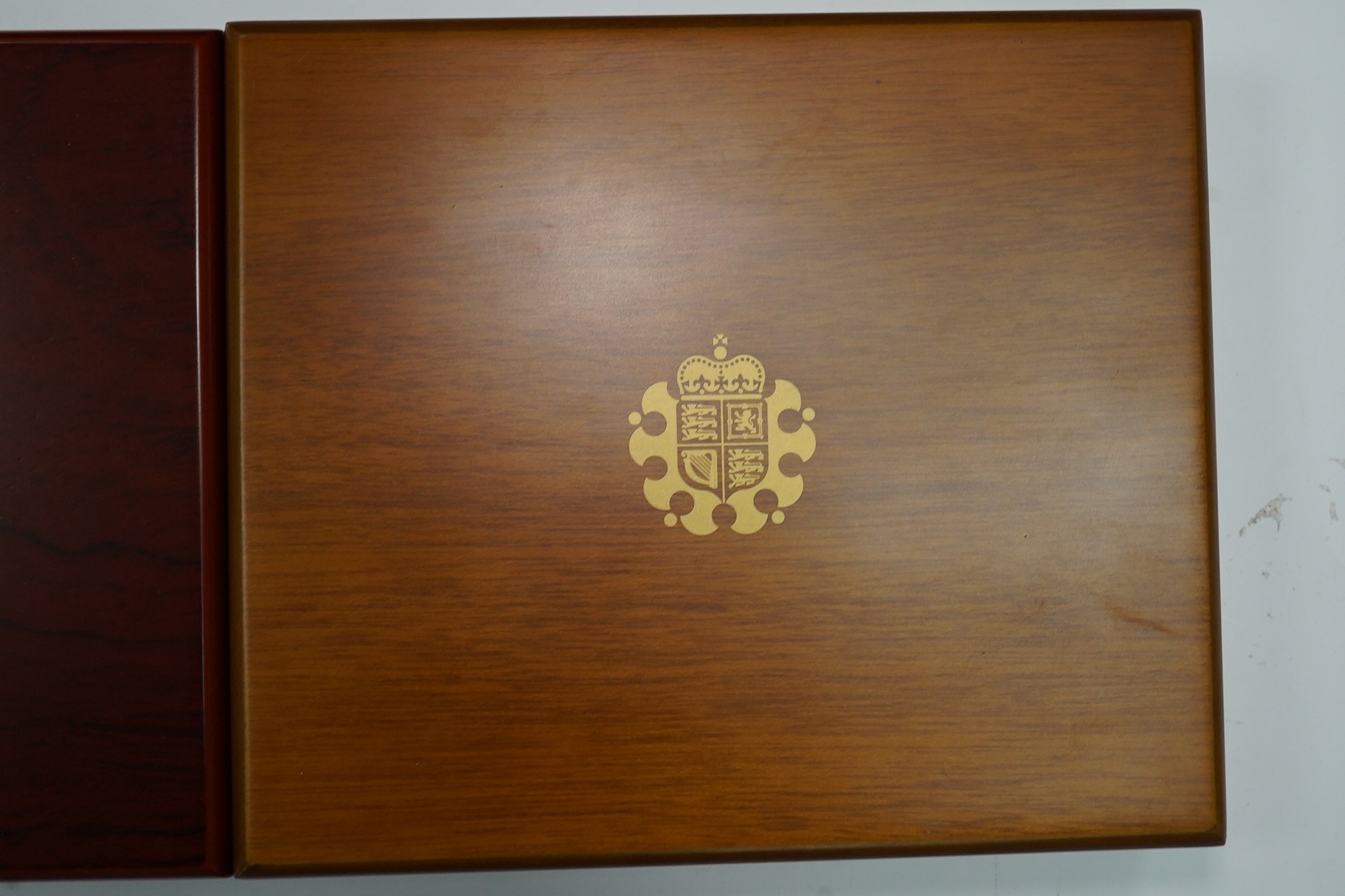 Royal Mint UK QEII coins, four executive proof coin sets, 2002 & 2003 in Golden Jubilee cases with certificates, 2007 & 2008, in wood cases of issue with certificates